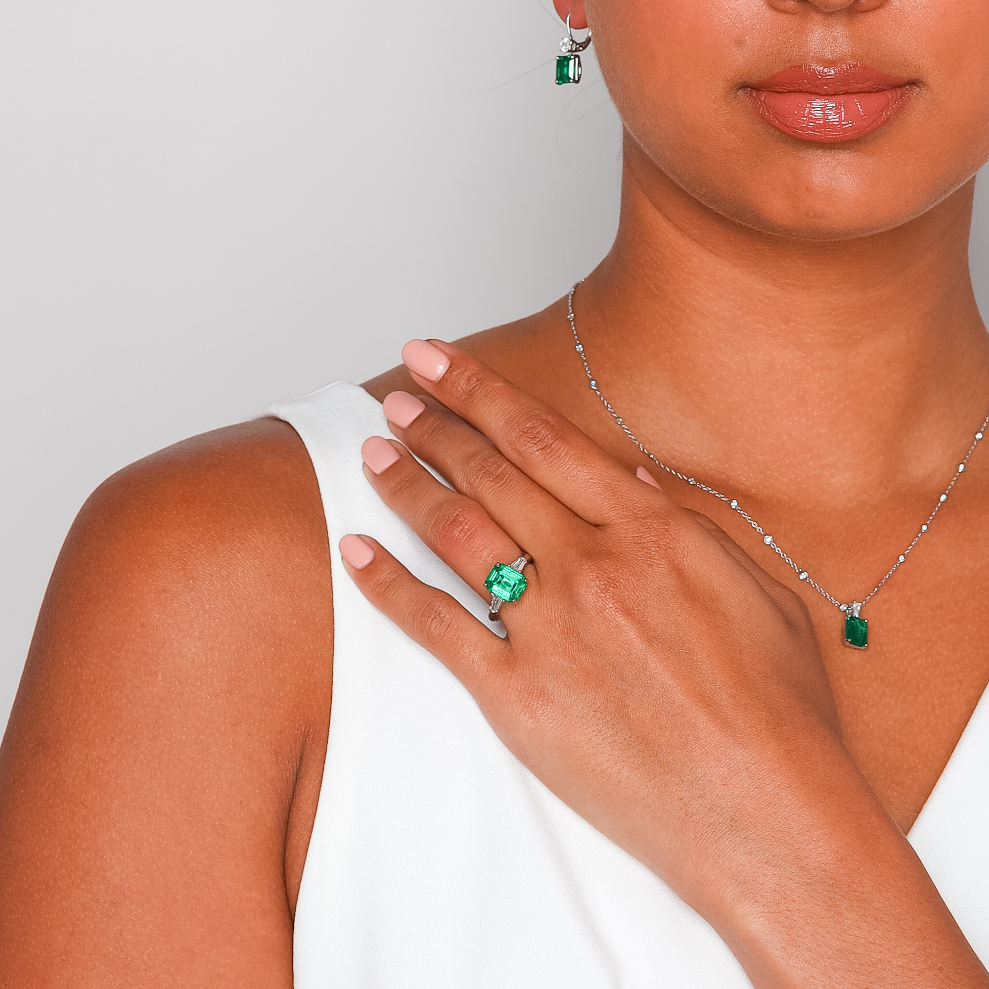 J.B. Star Emerald Cut Emerald & Tapered Baguette Diamond 3 Stone Ring in Platinum